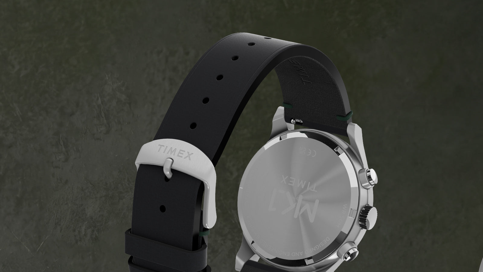 Rear view of the Timex MK1® Chronograph showing the stainless steel caseback, crown, pushers, and black leather strap.