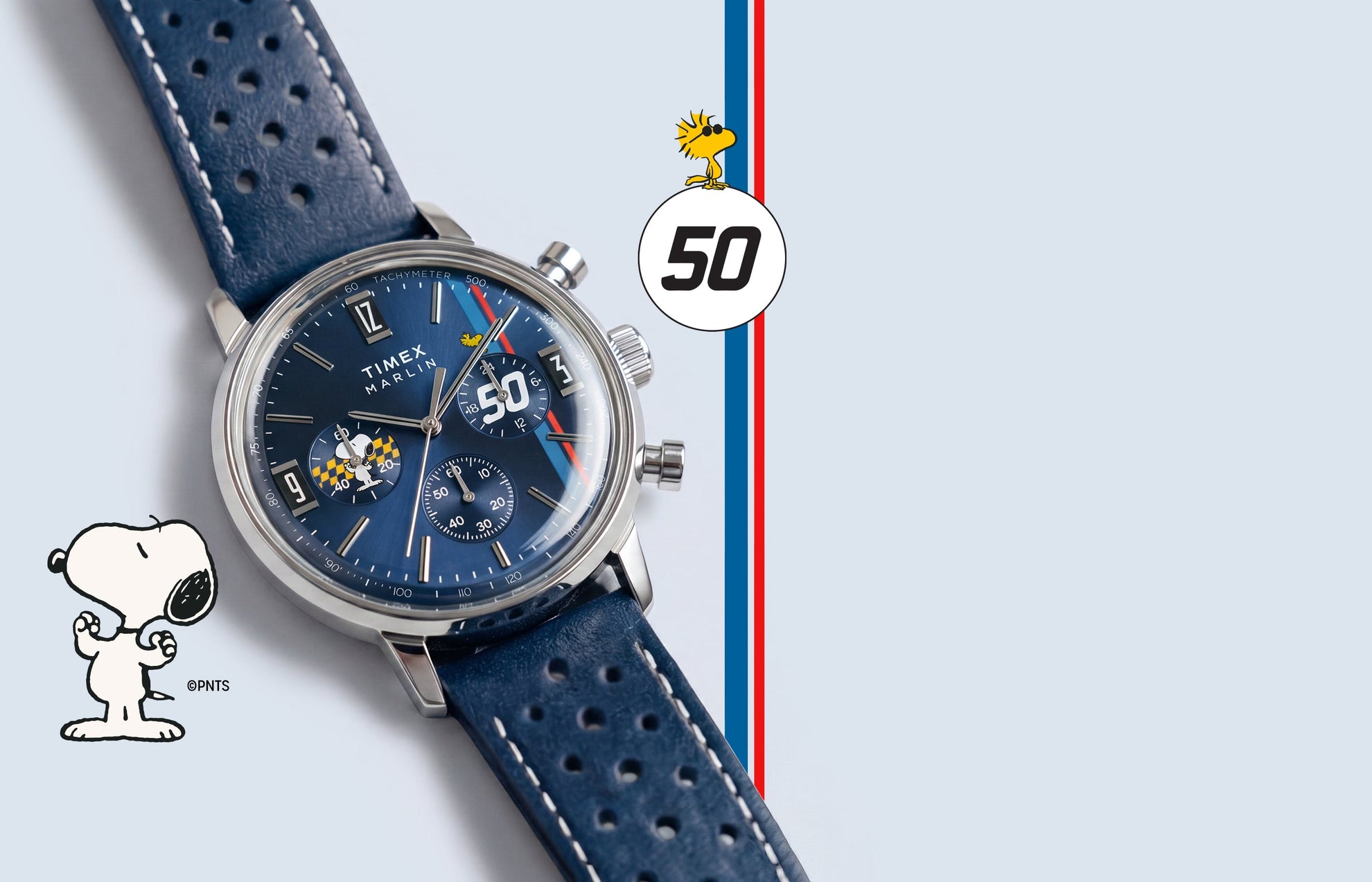 Peanuts® x Timex Marlin® Chronograph with blue dial, silver-tone case, perforated blue leather strap, and Snoopy-themed chronograph subdial.