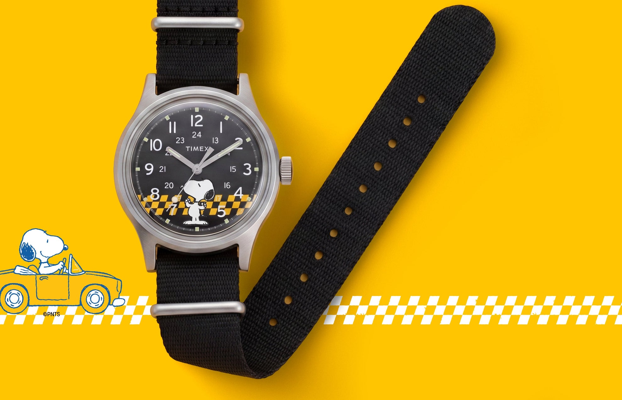 Peanuts® x Timex MK1® watch with a black fabric strap, black dial featuring Snoopy in sunglasses, and a yellow racing-inspired background with checkered graphics.