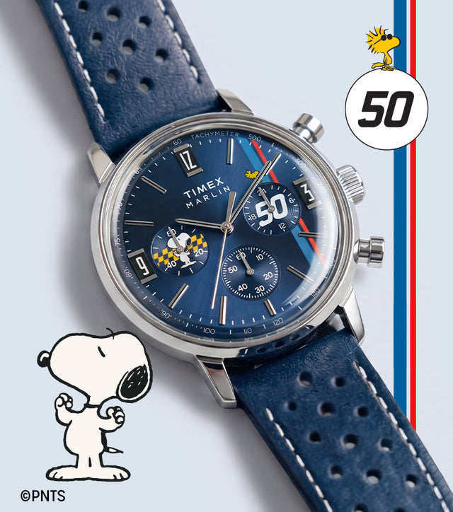 Peanuts® x Timex Marlin® Chronograph with blue dial, silver-tone case, perforated blue leather strap, and Snoopy-themed chronograph subdial.