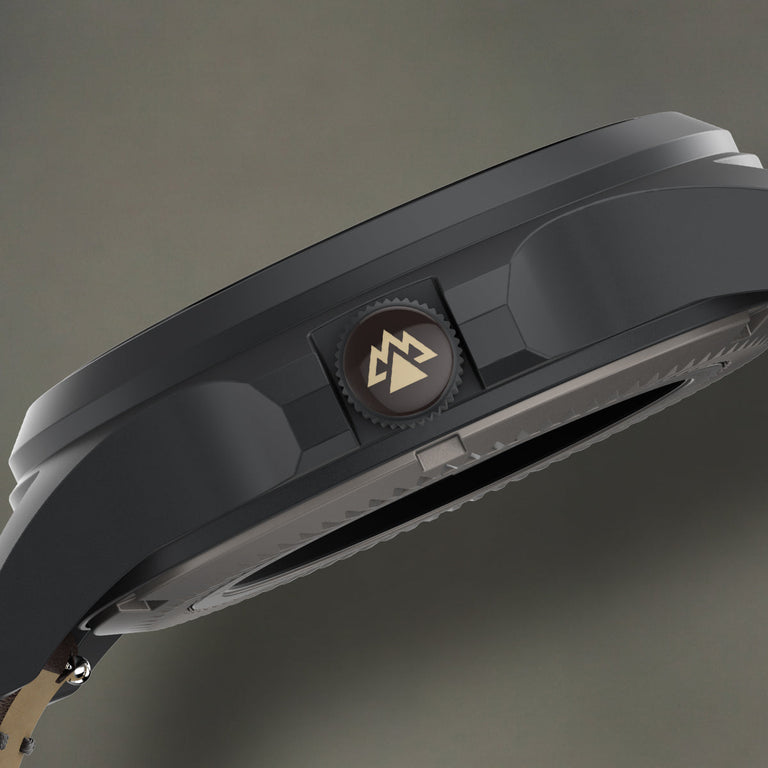 Side profile of the Expedition® Field Post Automatic titanium watch highlighting the signed screw-down crown.