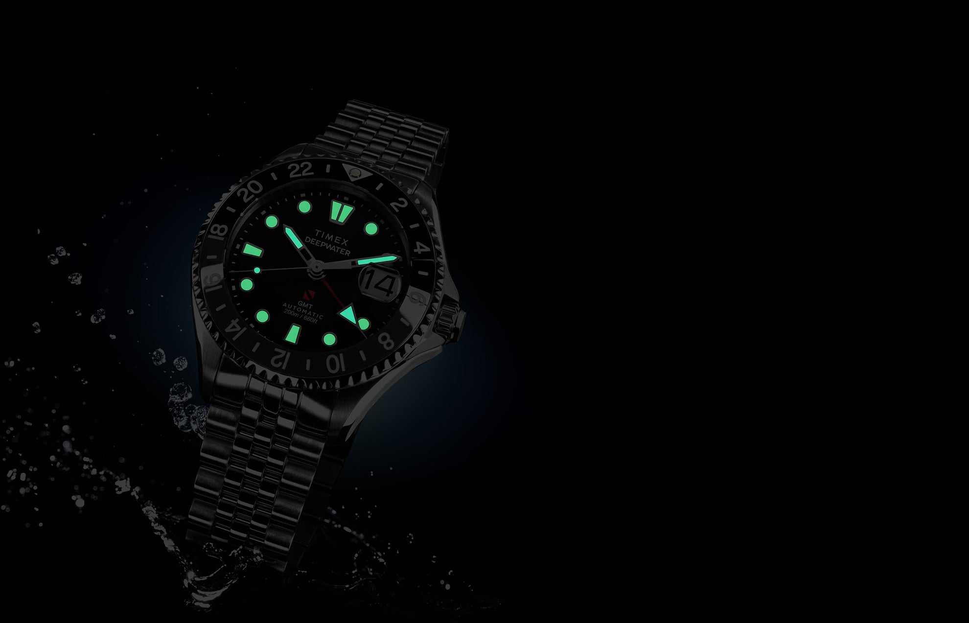 Timex Deepwater Meridian 200 Automatic GMT watch with luminous markers glowing in the dark, displayed against a black background with water splash effects.