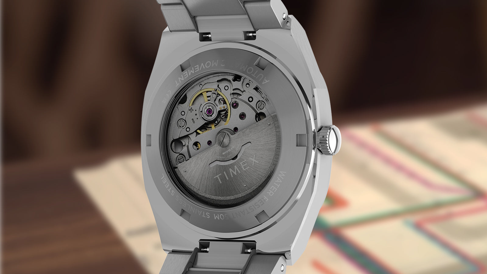 Rear view of the Timex® Automatic E Line 38mm showcasing the exhibition caseback and visible automatic mechanical movement through the transparent crystal.