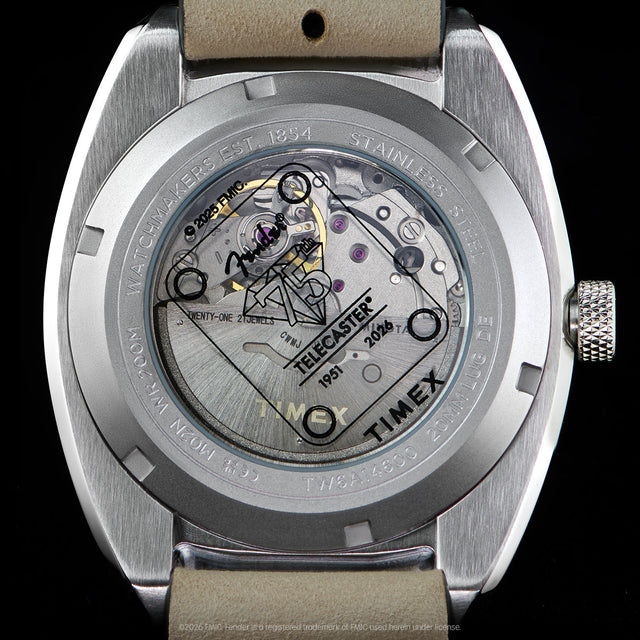 Close-up of the transparent caseback revealing the automatic movement and Fender Telecaster artwork.
