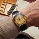 Fender x Timex Automatic watch worn on the wrist beside a Fender electric guitar.