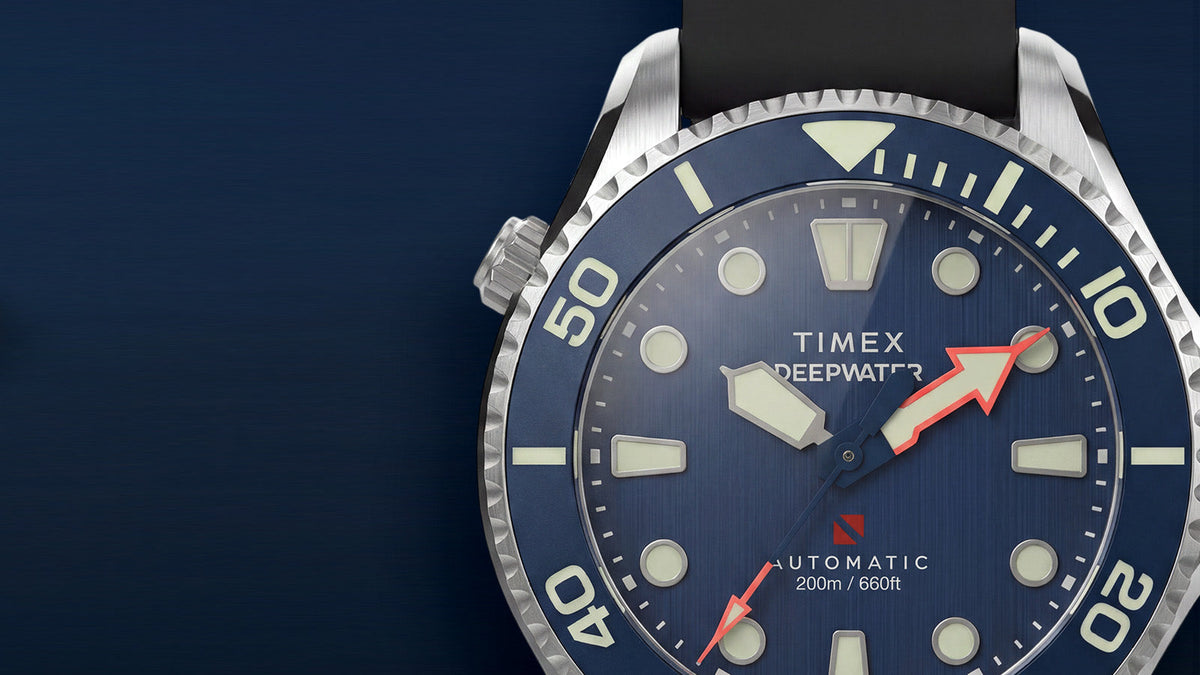 Detailed view of the Deepwater Meridian 200 HEV Automatic’s blue dial, luminous markers, blue bezel, and silver-tone case.