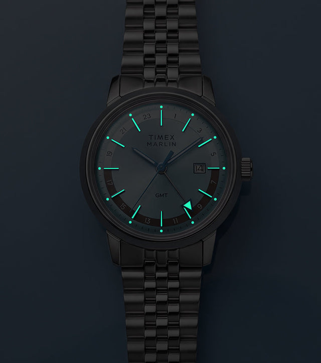 Marlin® Quartz GMT in low light with glowing hour markers and GMT hand.