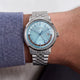 Marlin® Quartz GMT worn on the wrist, showcasing its icy blue dial and stainless-steel bracelet.