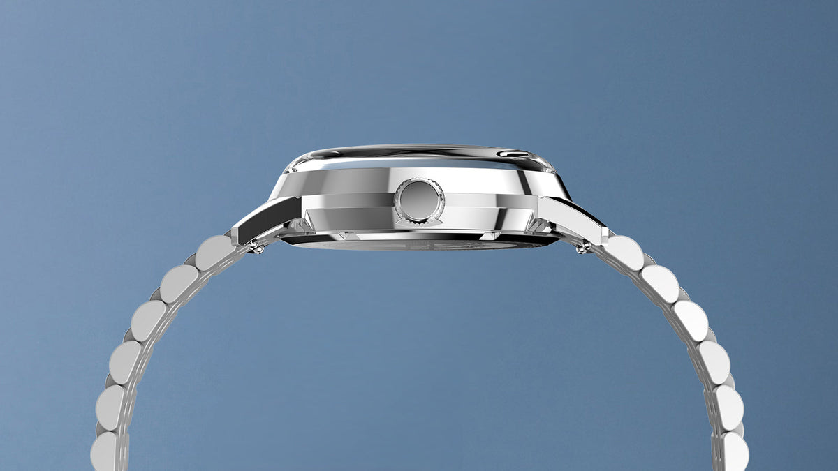 Side profile of the Marlin® Quartz GMT highlighting its polished case, crown, domed crystal, and stainless-steel bracelet.