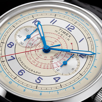 Close-up of the Marlin® Neo Classic Chronograph dial, highlighting its blue hands, red markings, and telemeter scale.