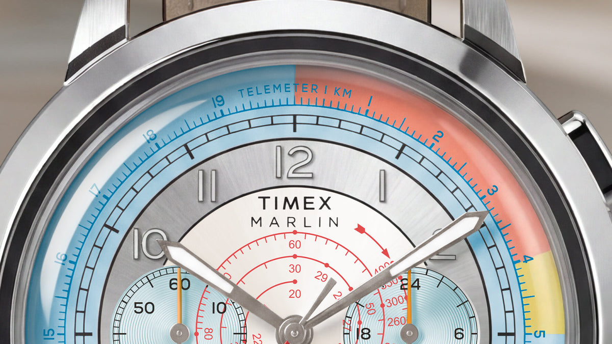 Close-up of the Marlin® Neo Classic Chronograph dial, highlighting its luminous hands, blue telemeter scale, and colorful markings.
