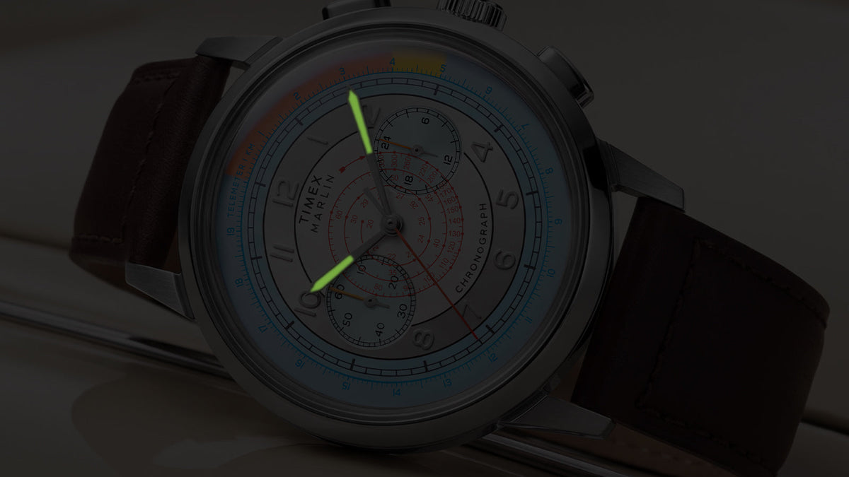 Close-up of the Marlin® Neo Classic Chronograph in low light with green luminous hands.