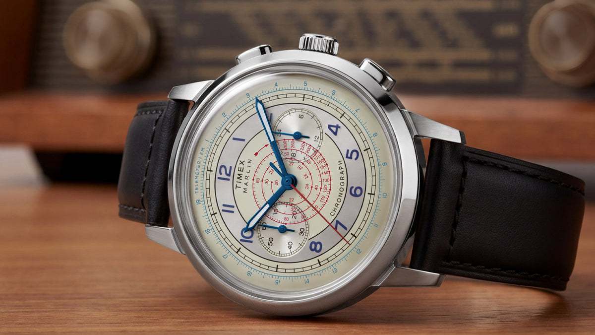 Close-up of the Marlin® Neo Classic Chronograph with a cream dial, blue Arabic numerals, and black leather strap.