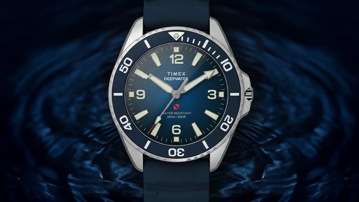 TW3A01900 Front view of the blue Deepwater Arctic 200 watch against a dark, rippling water background.