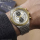 TW2Y75900 Harry Potter x Q Timex Time Turner watch worn on a wrist, with a silver-tone bracelet and star-patterned dial.