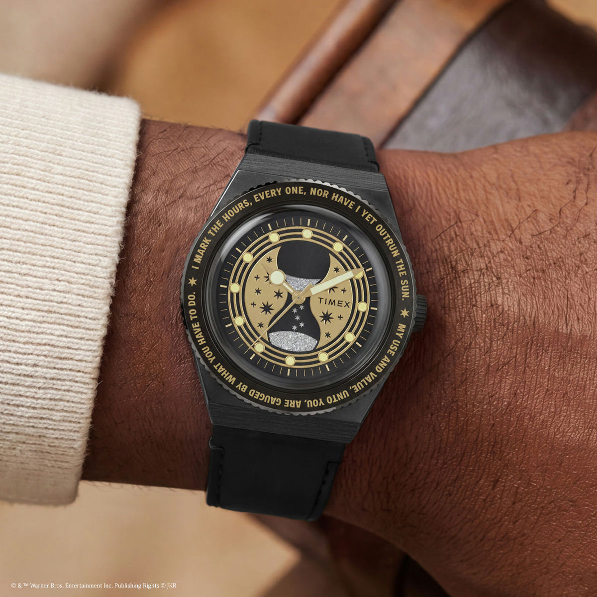 TW2Y76000 The black watch and strap worn on a wrist, showing the hourglass dial.