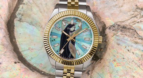 Jacquie Aiche watch in stainless steel and gold with a mother of pearl dial featuring a women figure. 