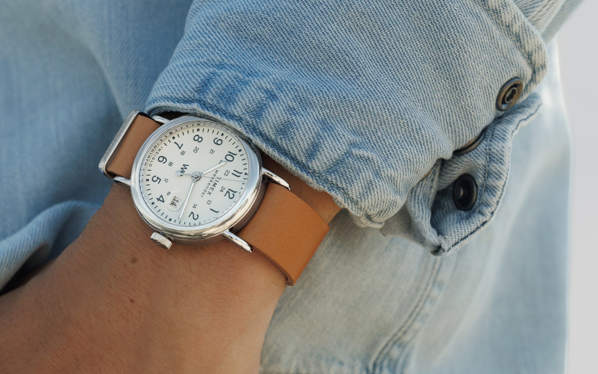 Weekender Brown Leather Strap Watch in a Wrist.