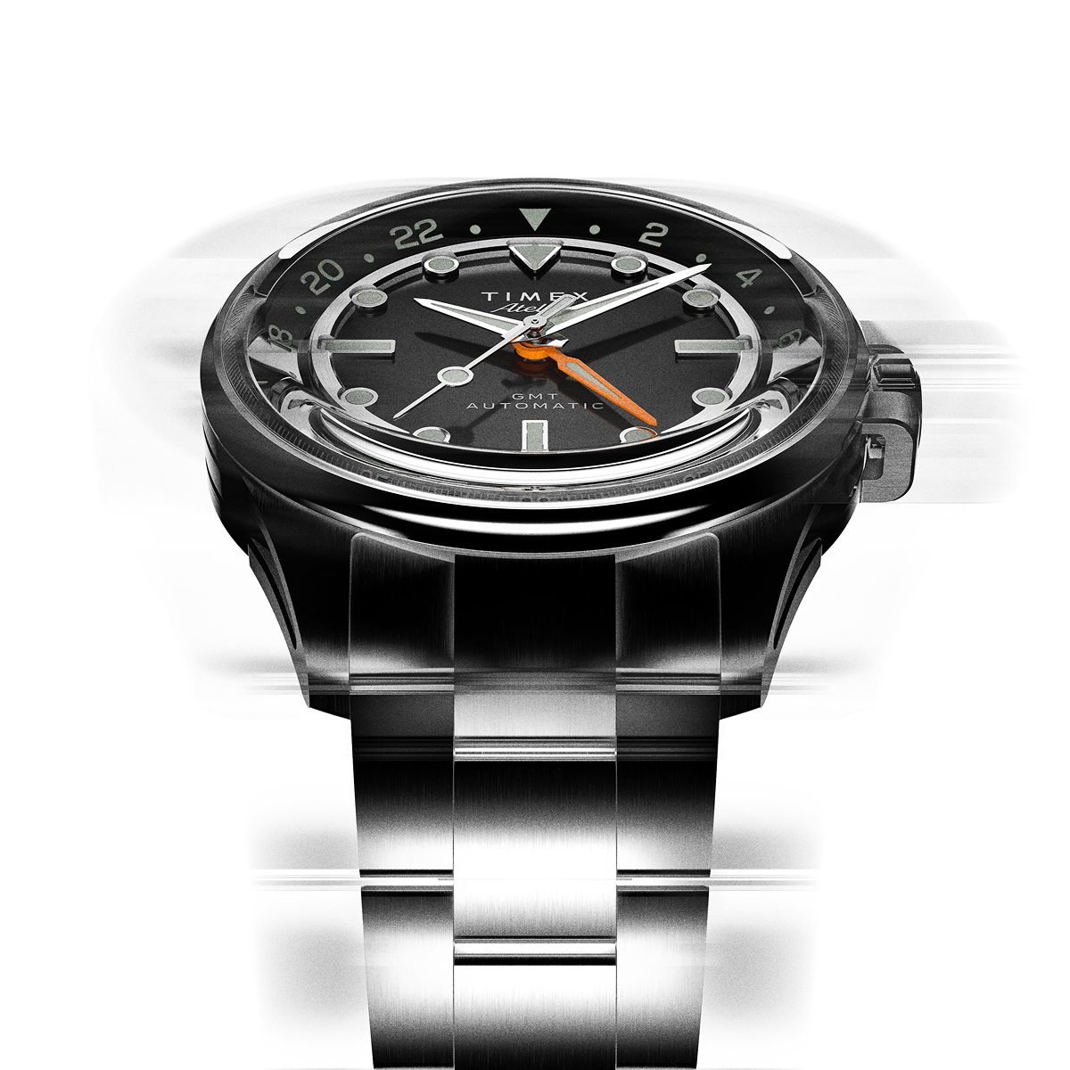 The Timex Atelier GMT Automatic photographed in motion, showcasing the dynamic design and reflective surfaces of the steel bracelet.