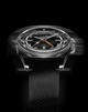 Artistic front view of the Timex Atelier GMT Automatic with motion blur, emphasizing its precision and craftsmanship.