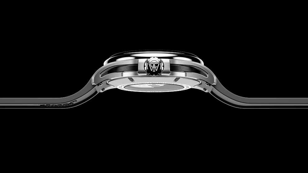 Slim side profile of the Timex Atelier GMT Automatic with black rubber strap and engraved crown detail.