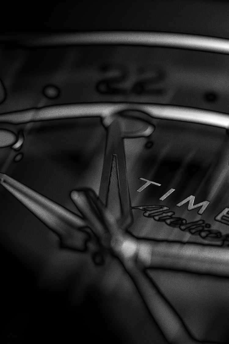 Close-up of the Timex Atelier GMT dial in monochrome, focusing on the polished hands and typography details.