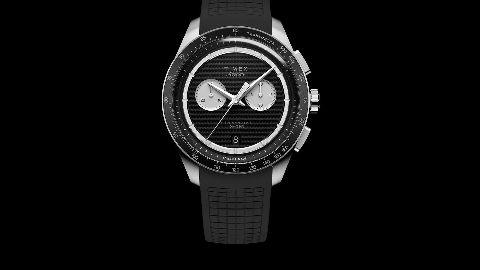 Front view of Timex Atelier Chronograph Quartz M1a 40mm with black dial, dual subdials, date window, and tachymeter scale
