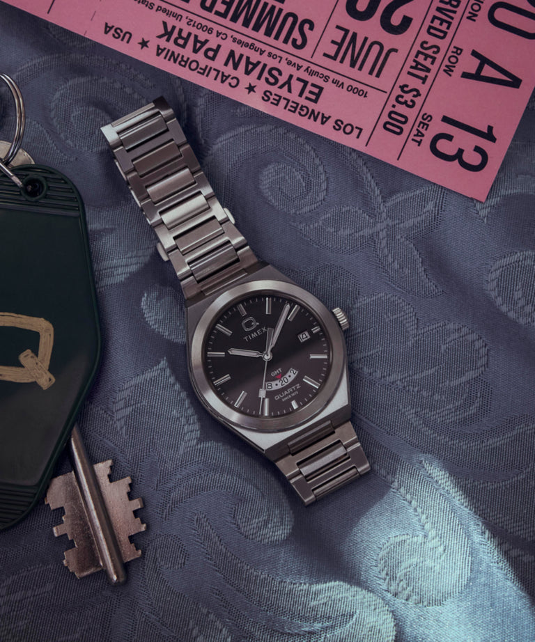 TW2Y12100 Q Timex® Continental GMT 39mm Stainless Steel Bracelet Watch Campaign Key Silhouettes (Beauty shots) Image