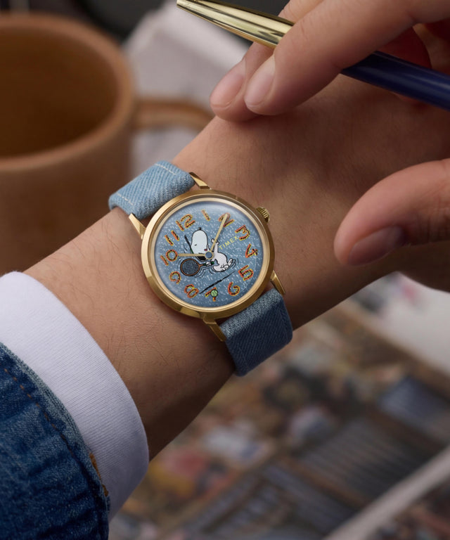 TW2Y12500 Peanuts® x Timex Marlin® 1965 Reissue Inspired Snoopy Tennis 34mm Fabric Strap Watch Primary Wrist Image