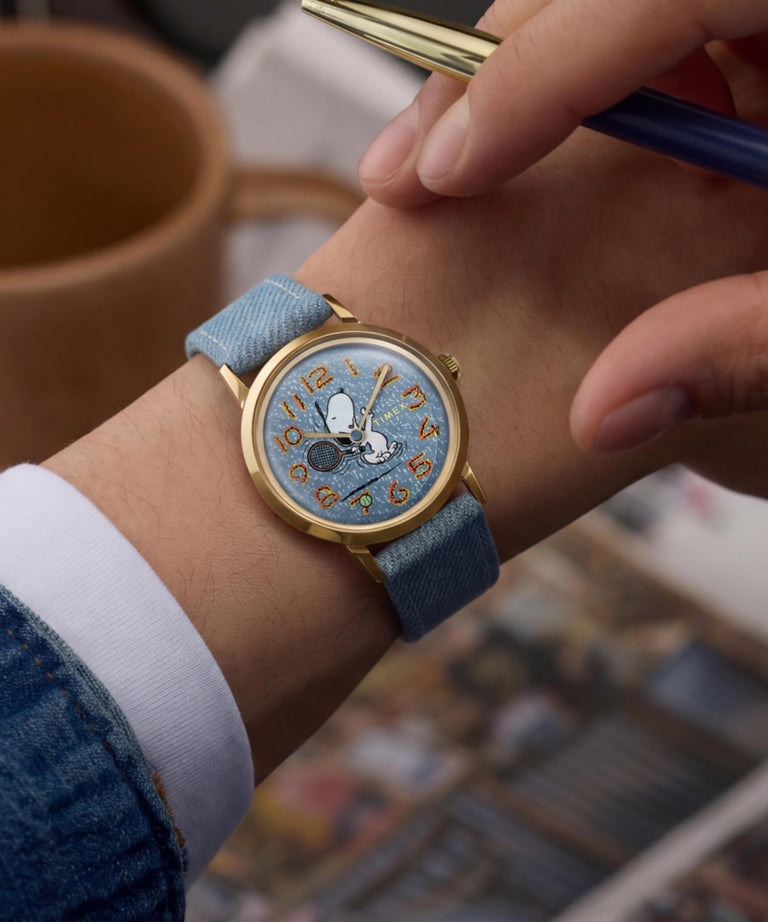 TW2Y12500 Peanuts® x Timex Marlin® 1965 Reissue Inspired Snoopy Tennis 34mm Fabric Strap Watch Primary Wrist Image