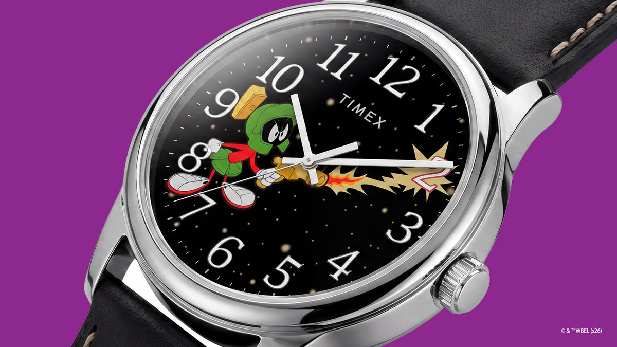 TW2Y99300 Angled view of the Marvin the Martian x Timex Easy Reader® watch with white numerals, colorful character artwork, and a polished silver-tone case.