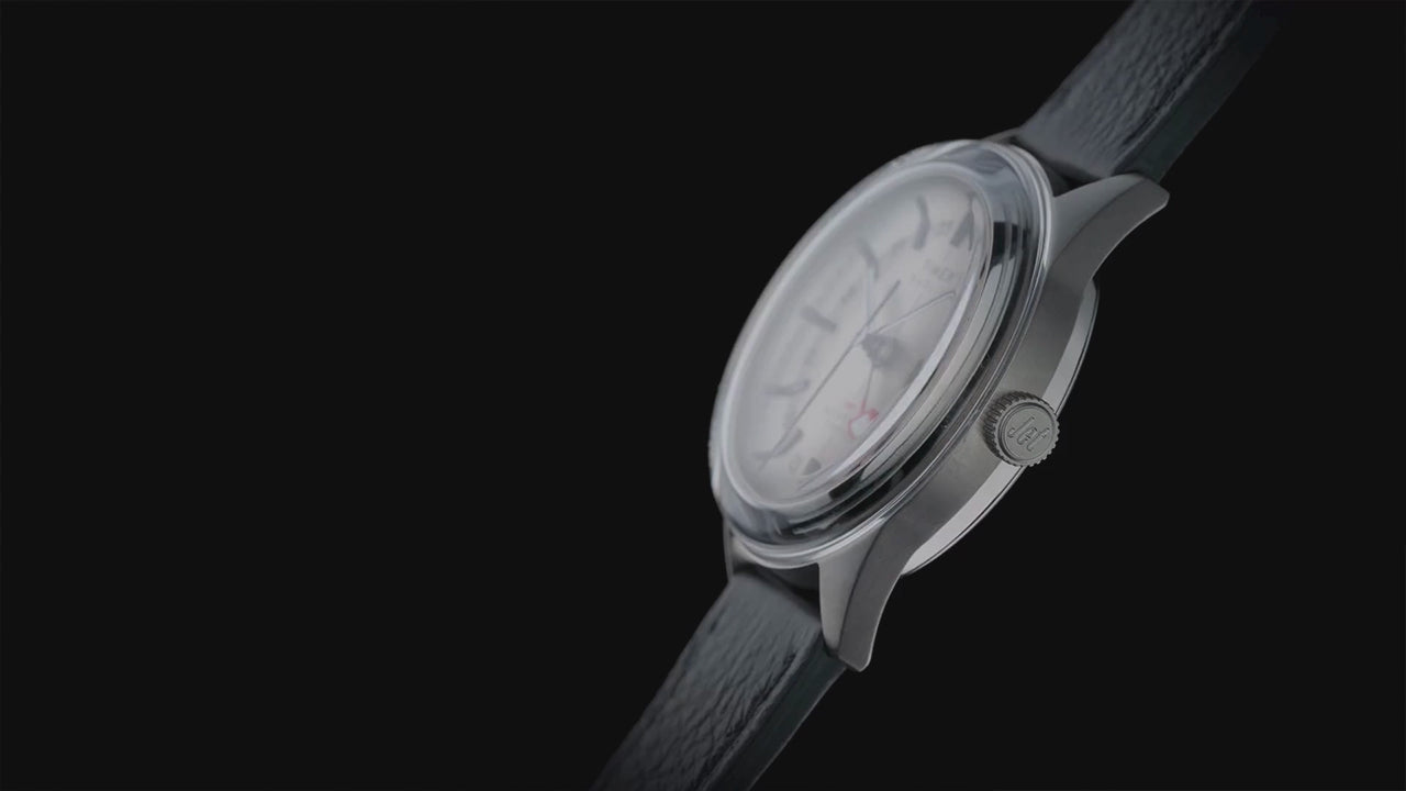 Timex Marlin® Jet Titanium Automatic GMT, highlighting its lightweight titanium case, automatic GMT movement, exhibition caseback, cream dial, and black leather strap from multiple angles.