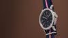 Weekender America 250 watch video highlighting the blue dial, red seconds hand, patriotic striped fabric strap, and America 250 commemorative design inspired by American heritage.