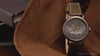 Video showcasing Harry Potter x Timex Weekender Sorting Hat watch highlighting dial artwork, bronze-tone case, and leather strap.