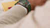 Product video of Peanuts® x Timex Expedition Snoopy Road Trip watch highlighting green dial, Snoopy and Woodstock red Jeep artwork, durable outdoor design, and INDIGLO® night-light feature.