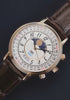 Timex 1990 Moon Phase and Calendar Dial Reissue transitions from an angled close-up to a centered full view against a dark background.