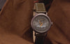 Video of Harry Potter x Timex Weekender Sorting Hat watch featuring a dial animation of the Sorting Hat revealing Hogwarts houses, shown with interchangeable fabric strap and casual styling